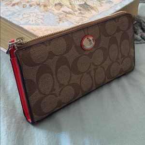 Brown Traditional Coach wallet with Coral Accent